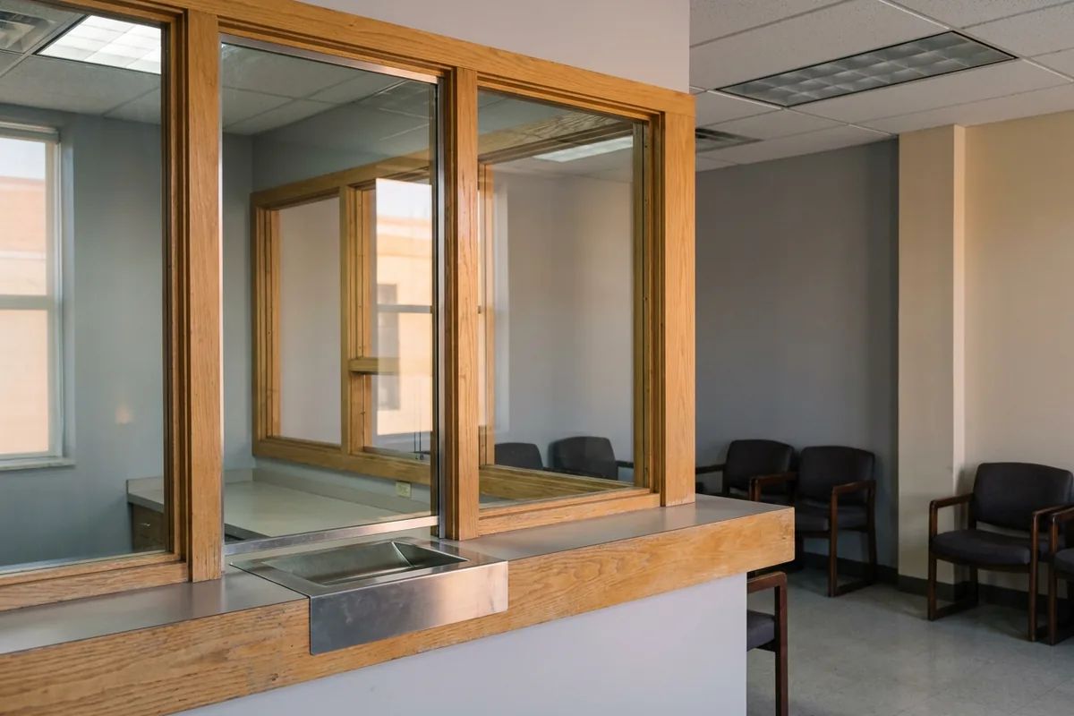 Cashier window at a county jail where you pay bail to get someone out